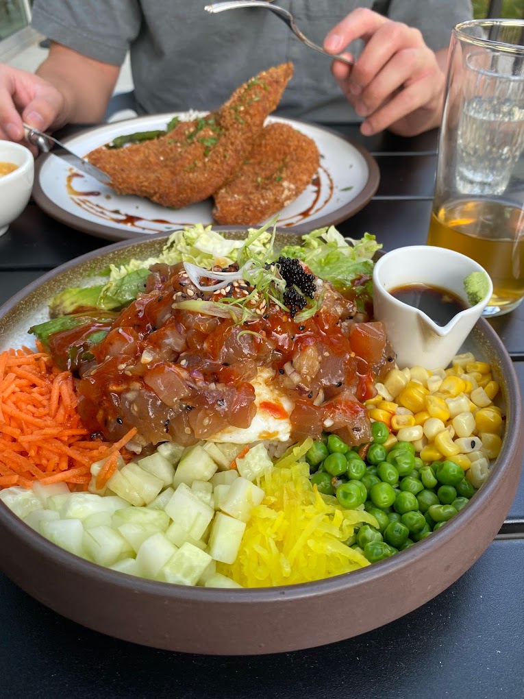 a close up of Gather Restaurants poke bowl and breaded chicken – photo by TY for Google Reviews